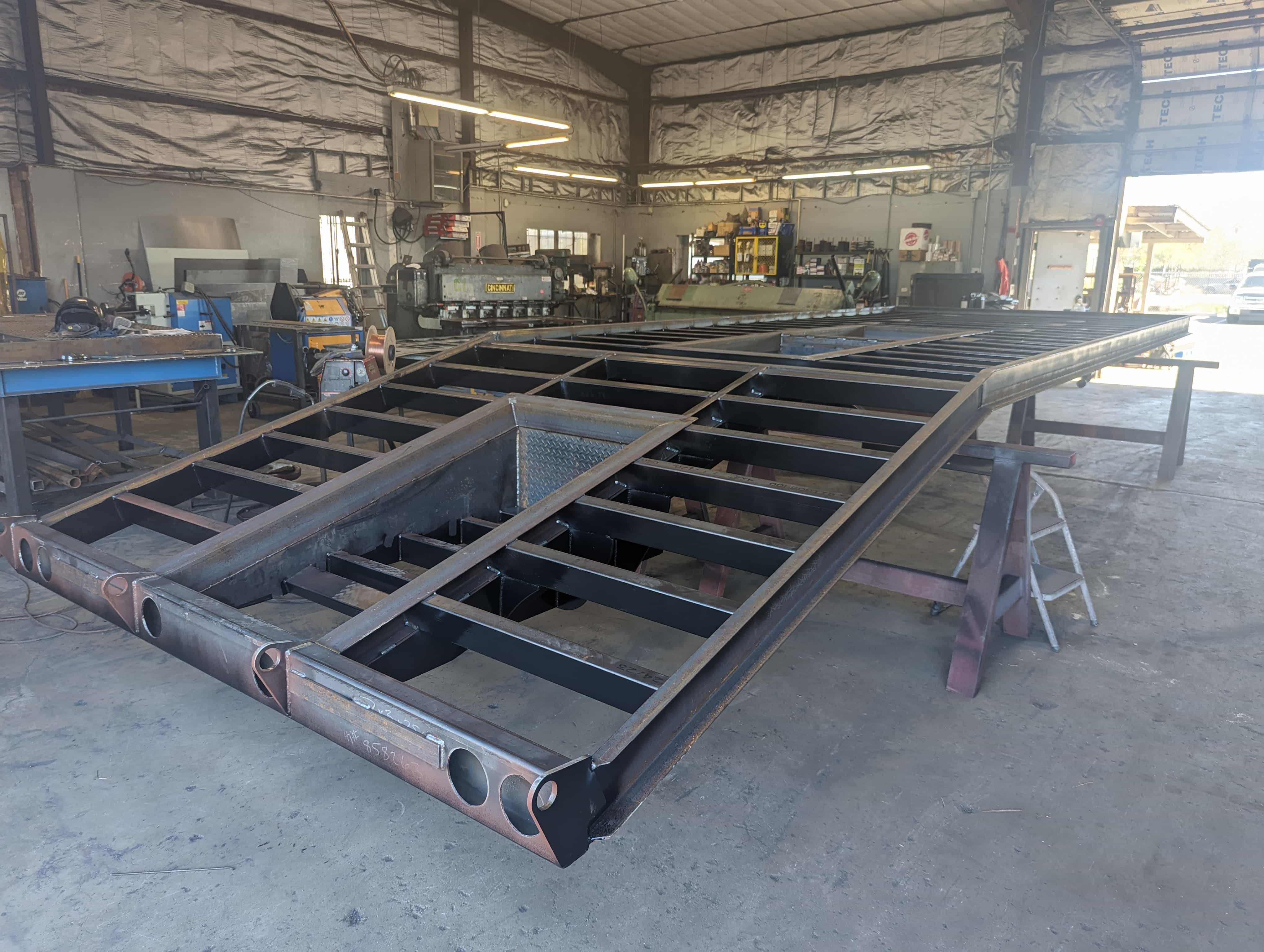 Heavy custom steel frame being built in the fabrication shop