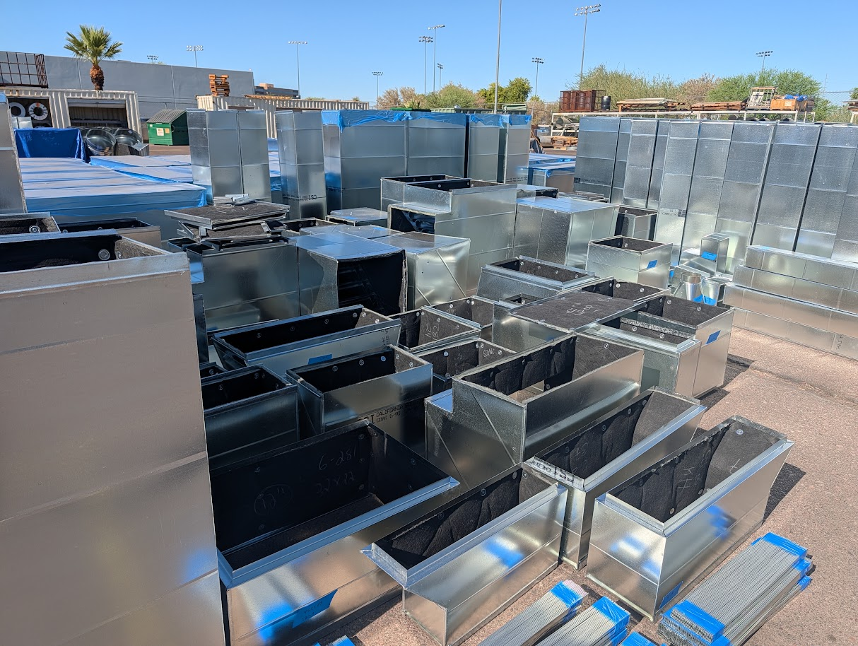 Staged HVAC ductwork and fittings ready for delivery