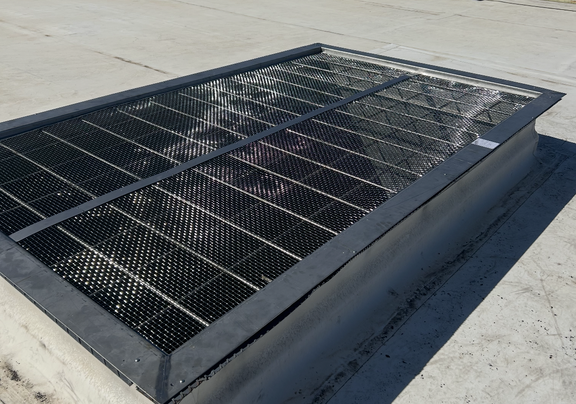 Security bars installed in a rooftop curb